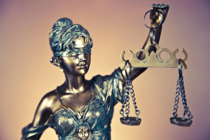 blind lady justice statue: RedLawList Criminal Law Article