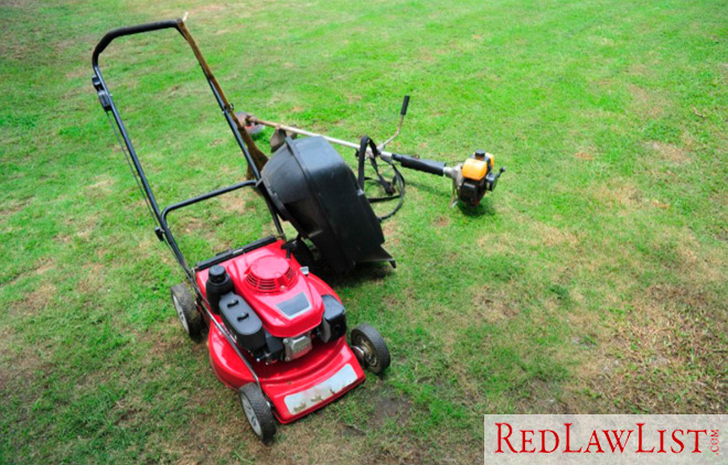 Image of a lawnmower and weed eater in the grass, indicating a grounds keeping job, a Florida job with the highest chance of fatal accident