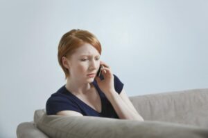 woman calling about insurance dispute