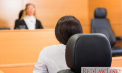 person in courtroom before judge