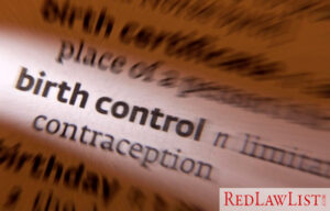 close-up dictionary page opened to the entry for “birth control”